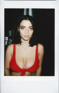 Julia Burch in a red bikini top on instant film, while working in Los Angeles